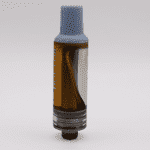 Close-up of a vape cartridge with amber liquid and a blue cap